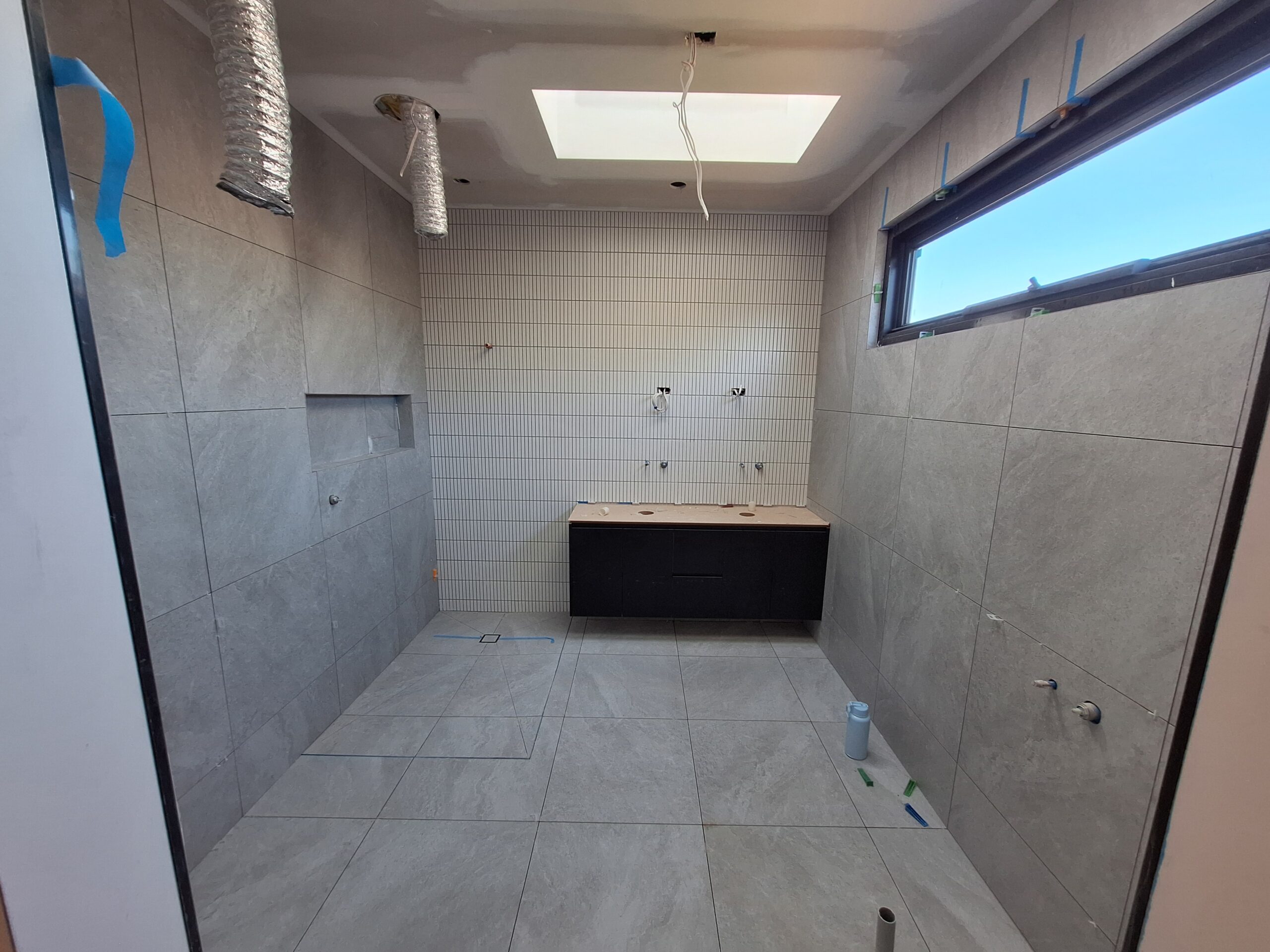 zeb tille and stone bathroom